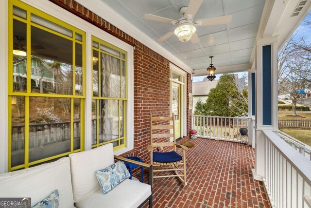 exterior space featuring covered porch and ceiling fan