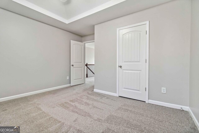 empty room featuring light carpet