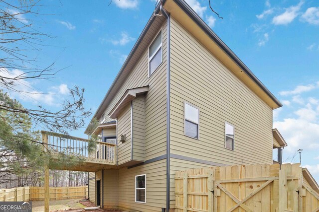 view of side of property featuring a balcony