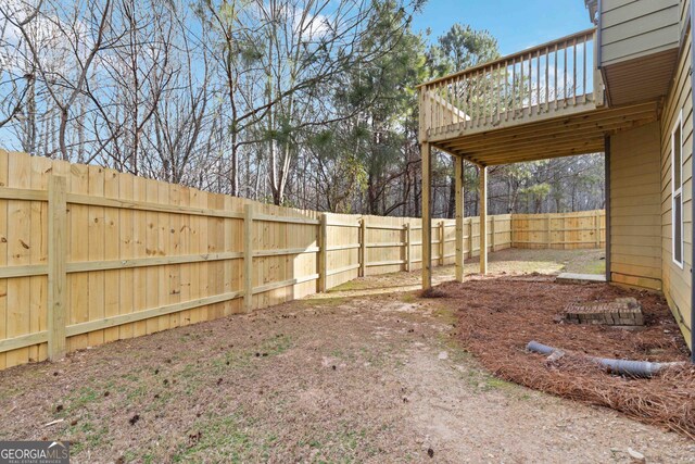 view of yard with a wooden deck