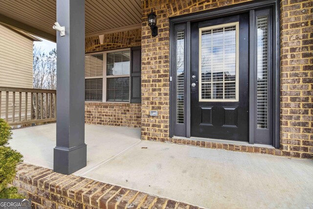 property entrance with a porch