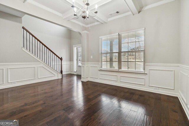 foyer entrance with beamed ceiling, crown molding, a healthy amount of sunlight, and dark hardwood / wood-style floors