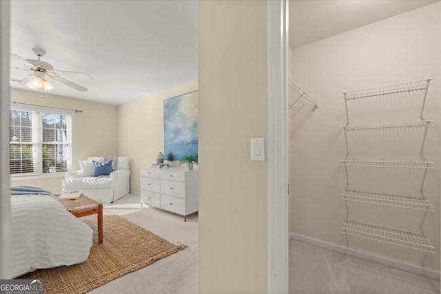 bedroom featuring ceiling fan and light colored carpet