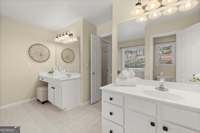 bathroom featuring toilet, tile patterned floors, and vanity