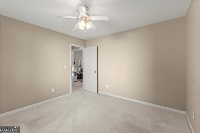 carpeted empty room with ceiling fan