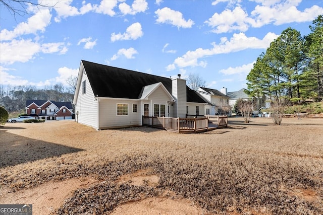 back of property featuring a deck