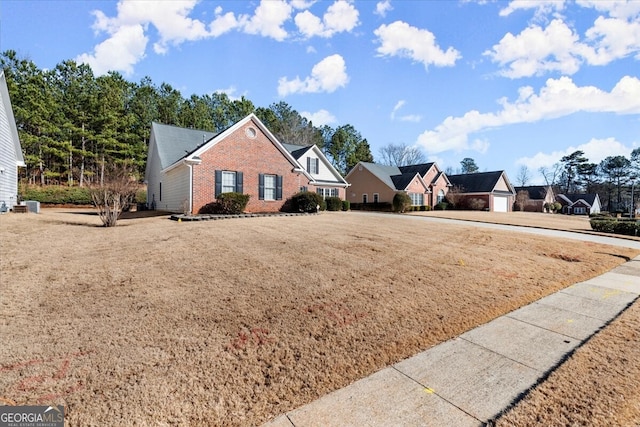 view of front property with a front yard and a garage