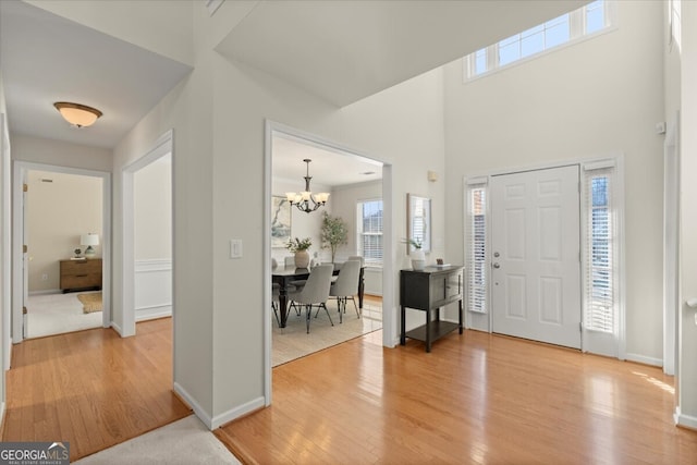 entryway featuring a notable chandelier and hardwood / wood-style floors