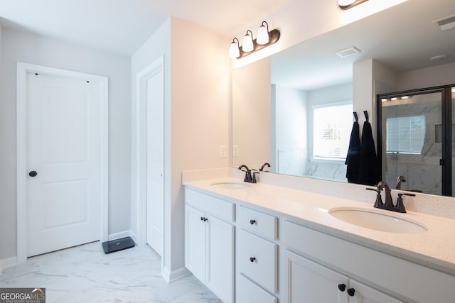 bathroom featuring vanity and an enclosed shower