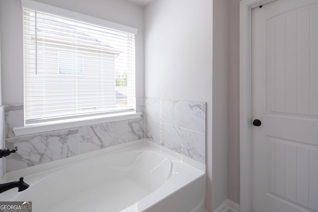 bathroom with a tub to relax in