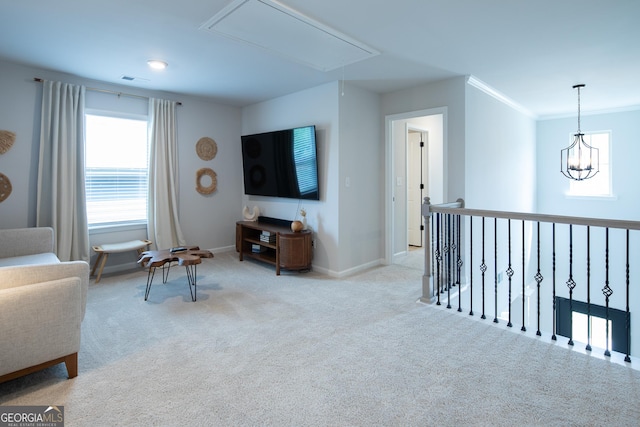 living room featuring crown molding, light colored carpet, and a notable chandelier