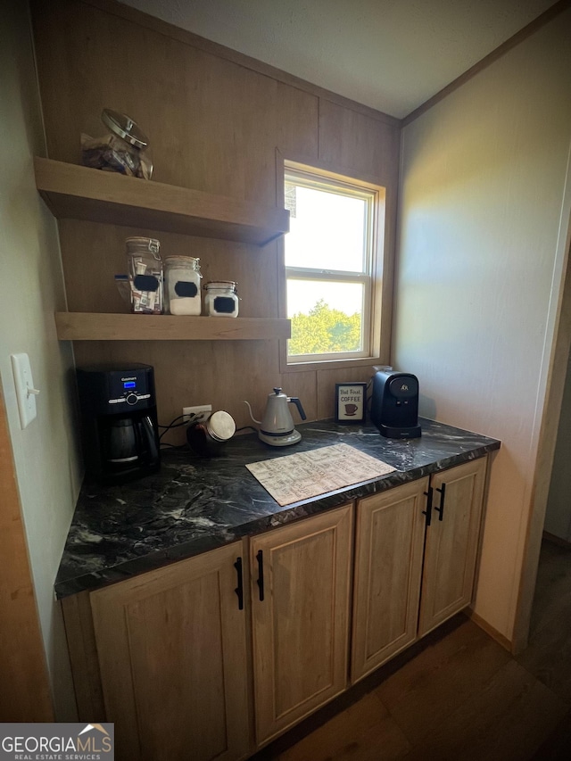 kitchen with dark stone countertops