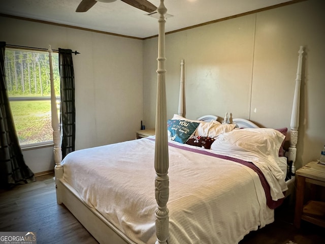 bedroom featuring ornamental molding, ceiling fan, and hardwood / wood-style floors