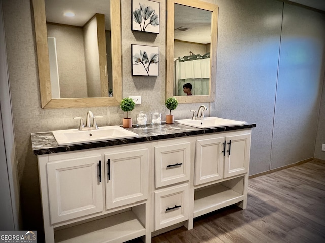 bathroom featuring vanity and hardwood / wood-style floors