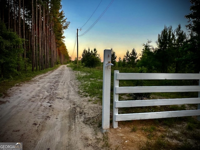 view of gate at dusk