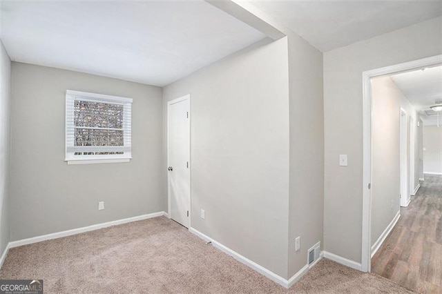 unfurnished room with carpet flooring