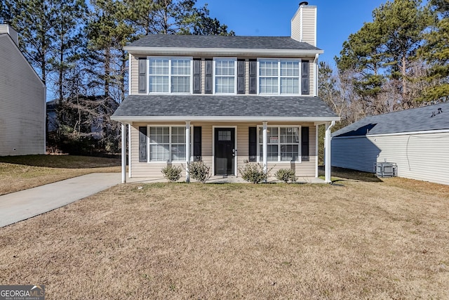 view of front of property featuring a front yard, covered porch, and cooling unit