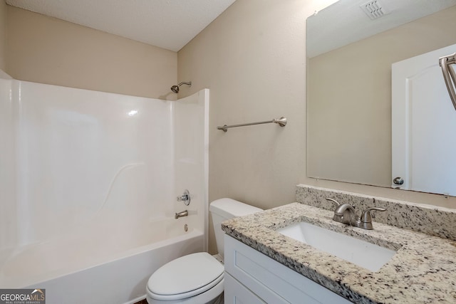 full bathroom featuring toilet, vanity, a textured ceiling, and bathing tub / shower combination