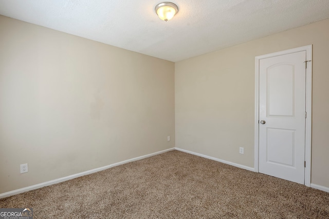 unfurnished room with carpet flooring