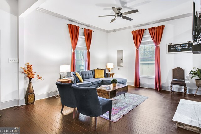 living room with electric panel, ceiling fan, crown molding, and dark hardwood / wood-style floors