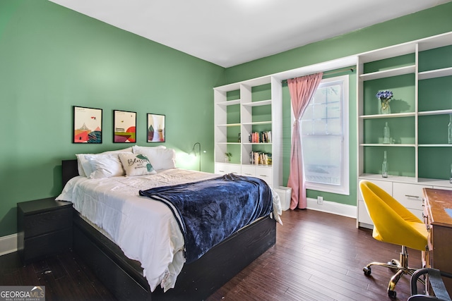 bedroom featuring dark hardwood / wood-style flooring