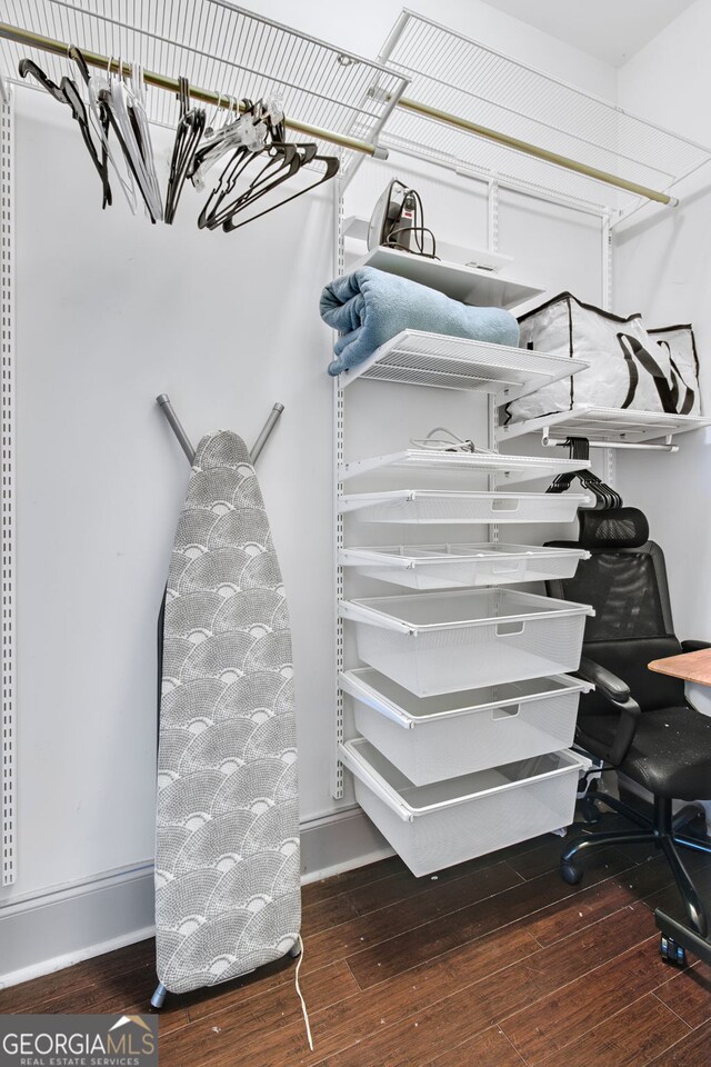 spacious closet featuring hardwood / wood-style floors