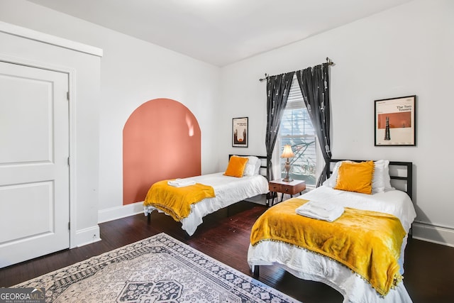 bedroom featuring dark wood-type flooring