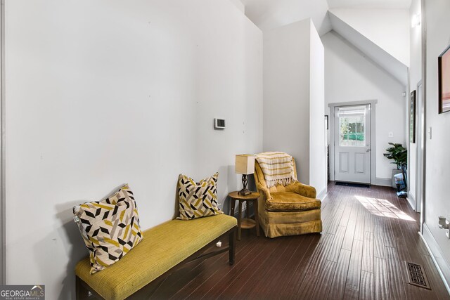 sitting room featuring lofted ceiling and hardwood / wood-style floors