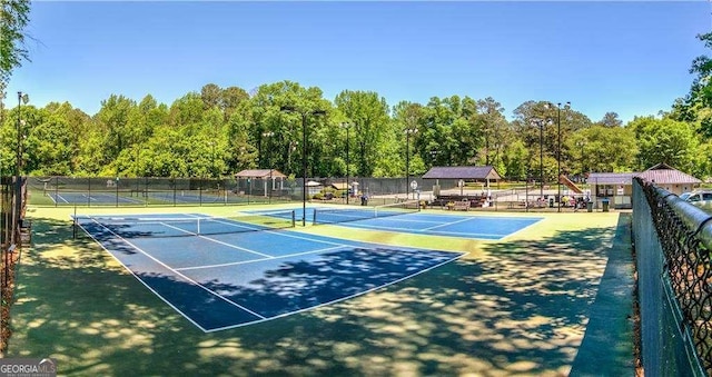 view of sport court with basketball hoop