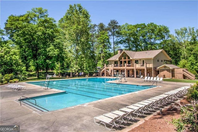 view of pool featuring a patio