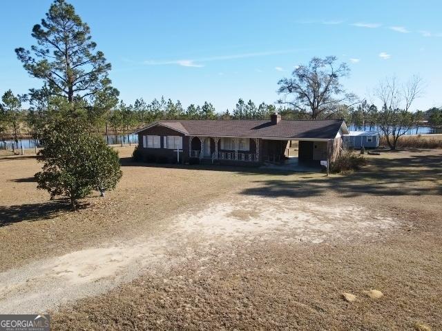 ranch-style house featuring a water view