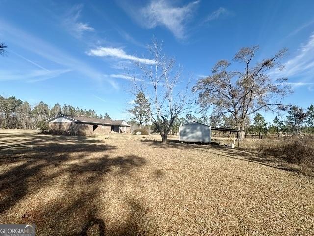 view of yard with a rural view