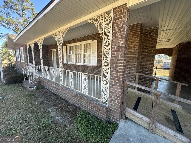 view of property exterior with a porch