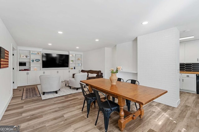 dining space featuring light wood-type flooring