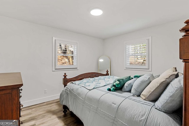 bedroom with light hardwood / wood-style floors