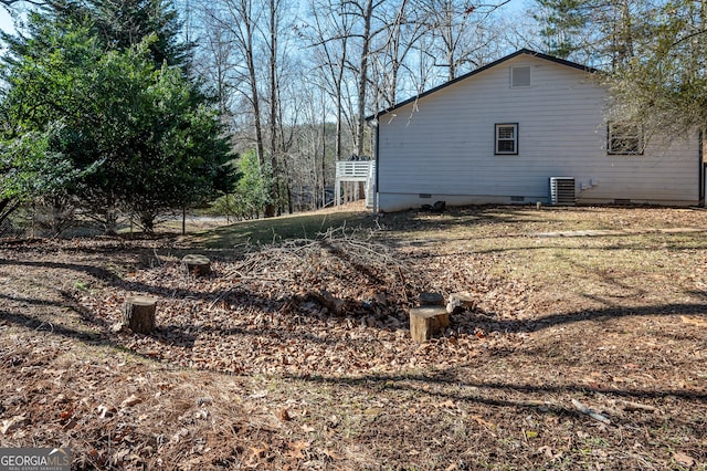 view of property exterior with central AC