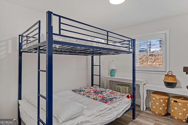 bedroom with wood-type flooring