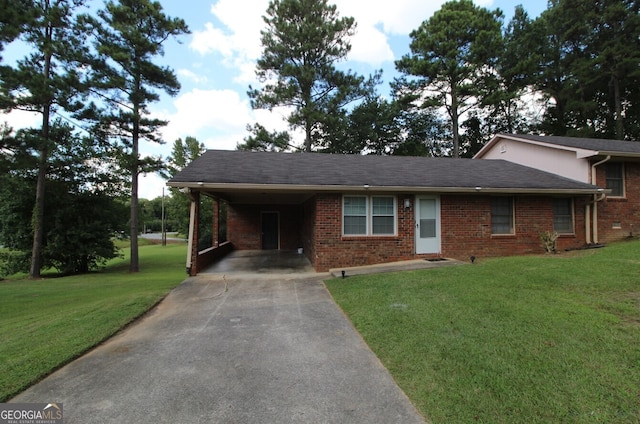 view of front of property with a front yard and a carport