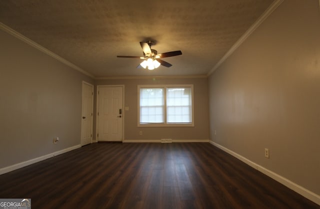 empty room with ceiling fan, crown molding, dark hardwood / wood-style floors, and a textured ceiling