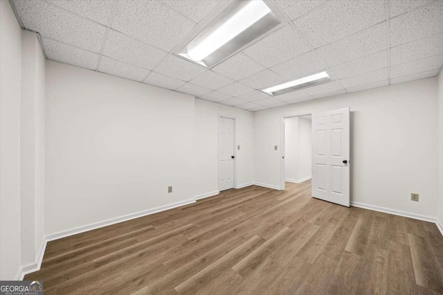 empty room with wood-type flooring