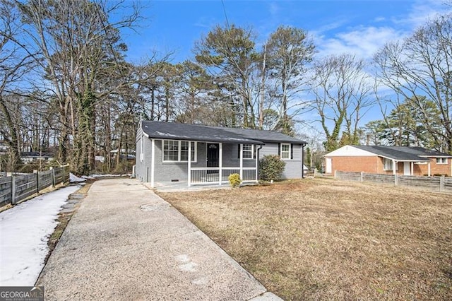 view of front of property with a porch and a front yard