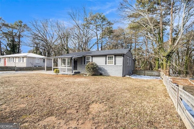 ranch-style home with a front yard