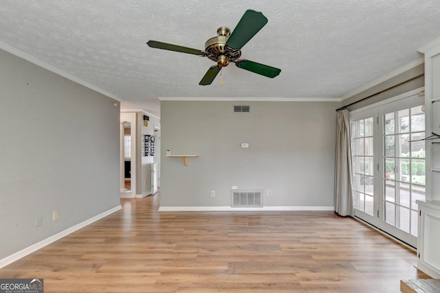 spare room with a textured ceiling, ceiling fan, crown molding, and light hardwood / wood-style flooring