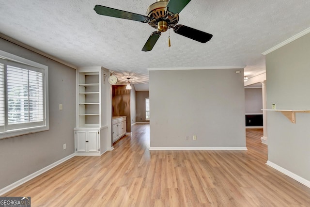 unfurnished living room with a textured ceiling, ceiling fan, light hardwood / wood-style floors, and crown molding