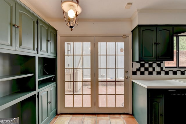 doorway featuring ornamental molding and light tile patterned floors