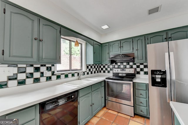 kitchen with stainless steel appliances, decorative backsplash, green cabinets, sink, and light tile patterned flooring