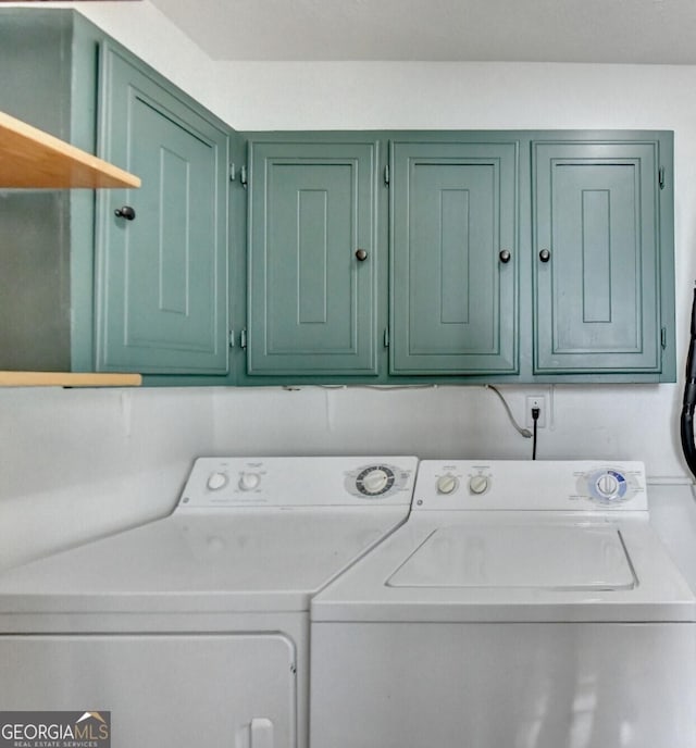 laundry room featuring cabinets and independent washer and dryer