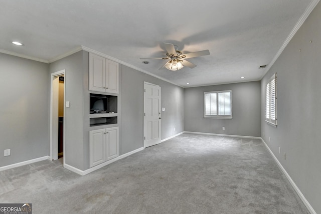 unfurnished living room featuring light colored carpet, ceiling fan, and ornamental molding