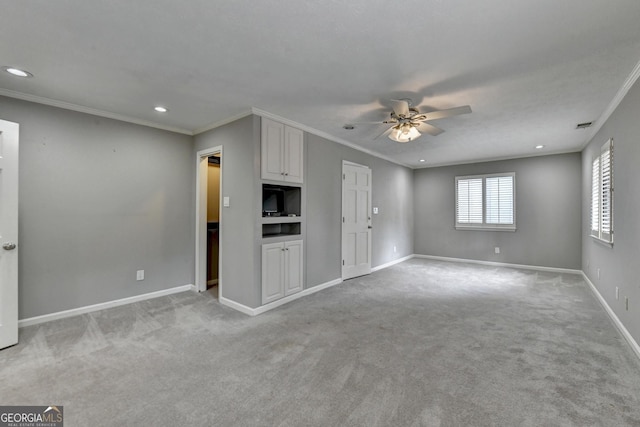 unfurnished living room with ornamental molding, light colored carpet, and ceiling fan