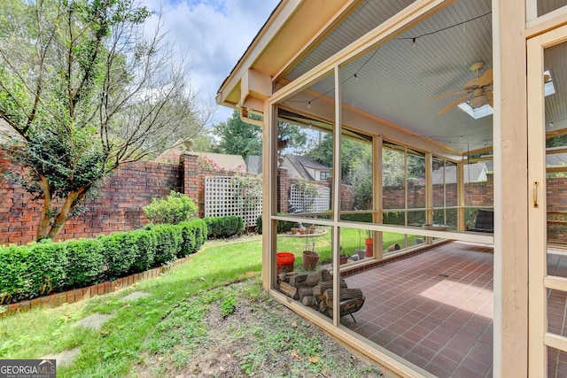 view of yard with ceiling fan